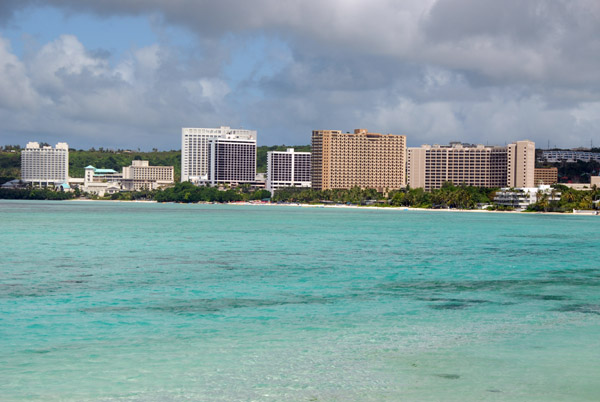 Shallow blue water of Tumon Bay with the Hyatt Regency, Outrigger, Guam Reef Hotel, Westin and Aurora (right to left)