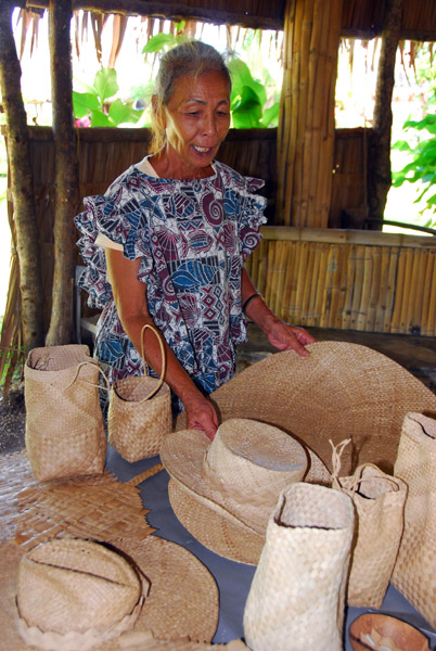 Chamorro woman showing traditional weaving