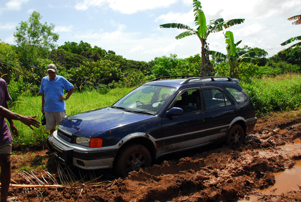 Stuck in the mud on the road to Melekeok  within 1/2 mile of the new Palau Capitol building
