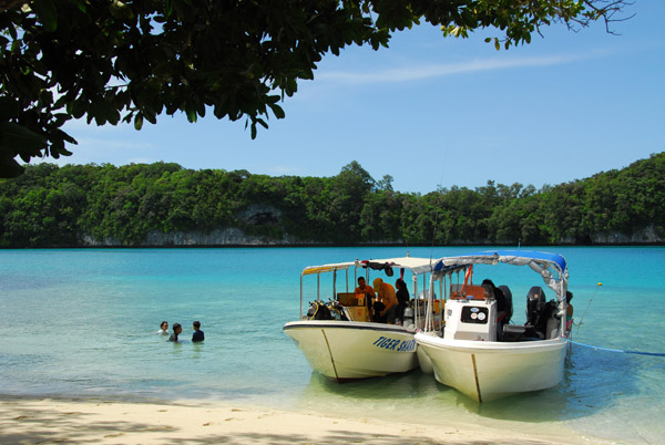 Boats pulled up at the beach of north Kemurbeab, Omekand Islands, Palau