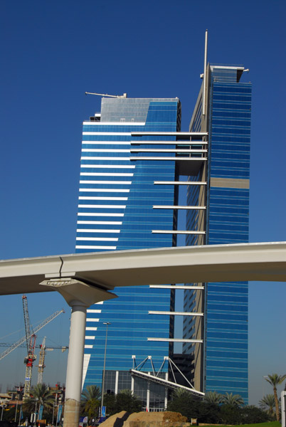 Dubai Metro crossing Trade Centre Roundabout in front of Monarch Office Tower