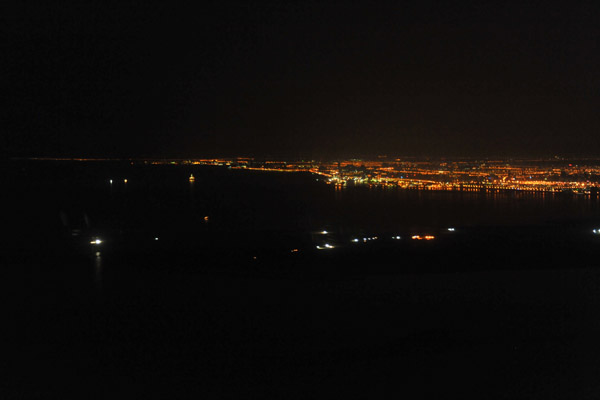 The lights of Sharjah and Ajman from over the Gulf