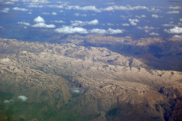 Turkey - Green valleys and what looks like dusty colored snow still on the mountains