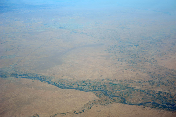 Farmland along the Great Zab River, Iraqi Kurdistan, with Erbil in the distance