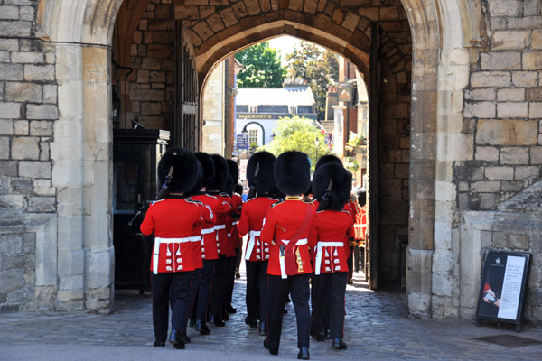 The retiring guards exit through Henry VIII Gate
