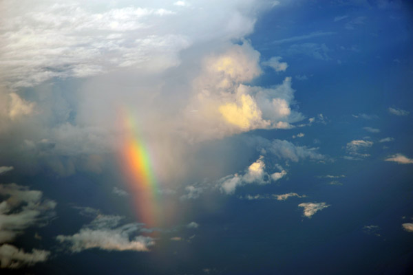 Rainbow at the base of a thunderstorm off Borneo, Indonesia