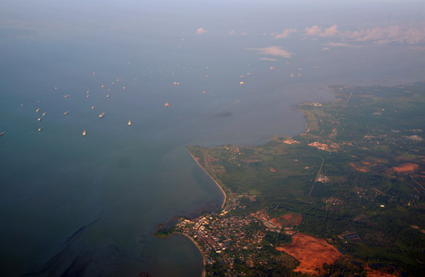 Ships moored in the Singapore Strait off Sungai Rengit (Johor) Malaysia