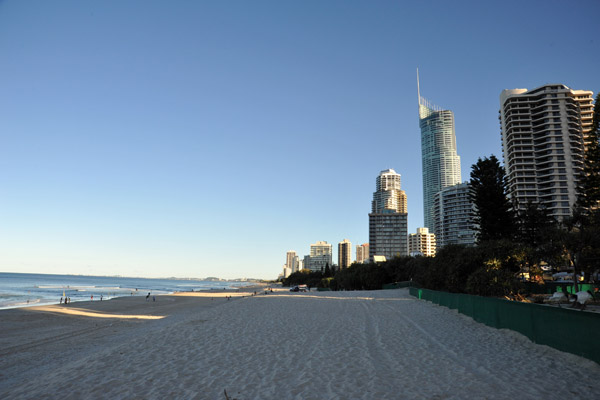 The beach at Surfers Paradise lies in shadow in the afternoon