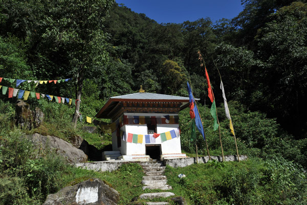 A small Bhuddist shrine with prayer flags