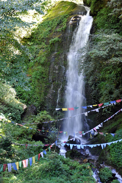 Waterfall with prayer flags - Shiv Mandir Shrine