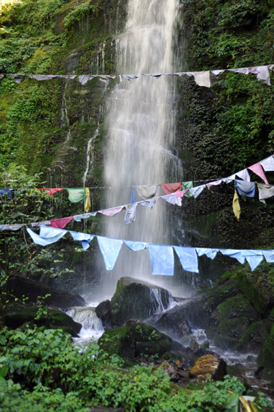Waterfall with prayer flags - Shiv Mandir Shrine