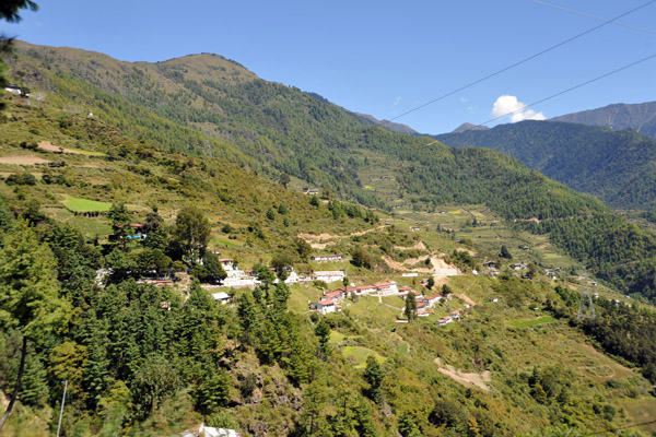 Village clinging to the hillside near Chapcha, Bhutan
