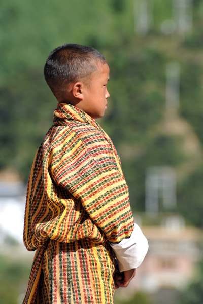 A Bhutanese boy solemnly watching the proceedings 