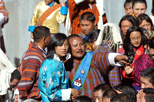 A Bhutanese official (blue sash) giving directions, Tsechu Festival