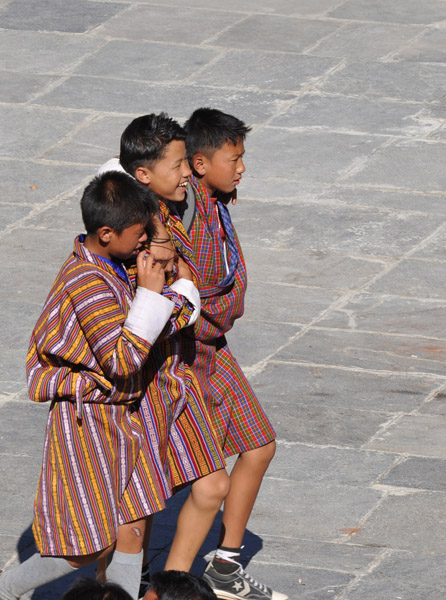 Bhutanese boys marching together, arm in arm