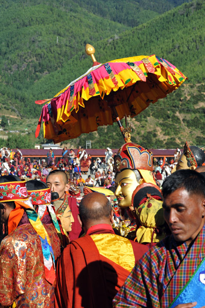 Umbrella held over the masked monk representing Guru Rinpoche