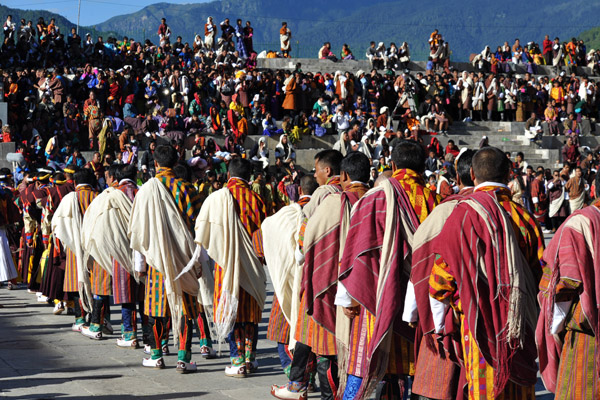 A line of Bhutanese men at the Tsechu Festival