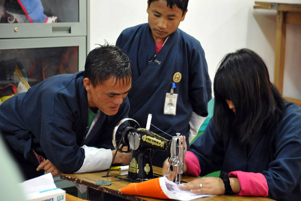 Girl at a sewing machine, National Institute for Zorig Chusum