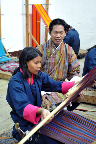 Student working on a traditional Bhutanese textile pattern