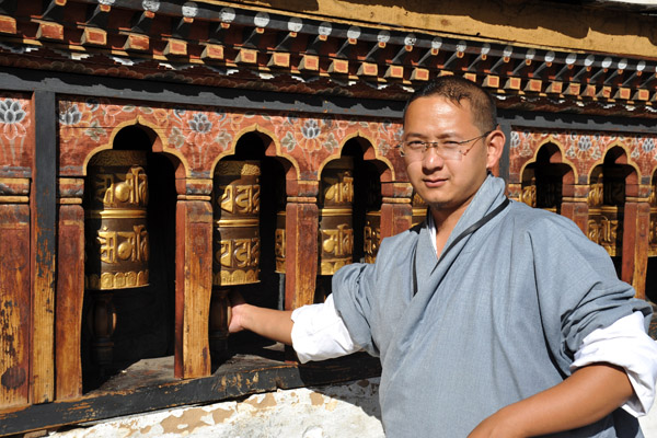 Tandin spinning the prayer wheels, Changangkha Lhakhang