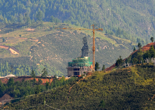 A giant Buddha under construction overlooking Thimphu