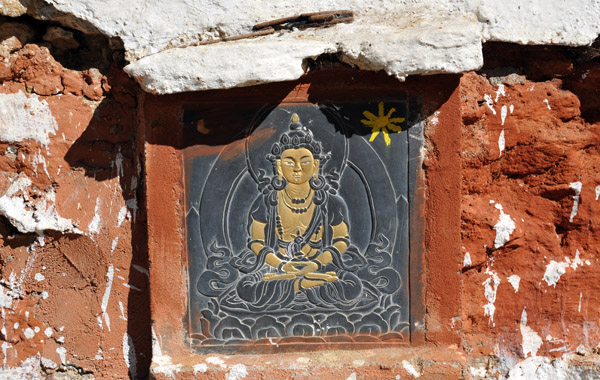 Slate relief of Buddha on one of the 108 Chortens