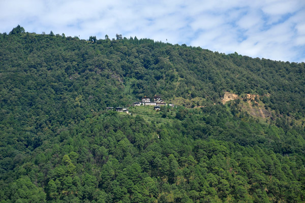 A monastery high on a hill on the opposite side of the valley