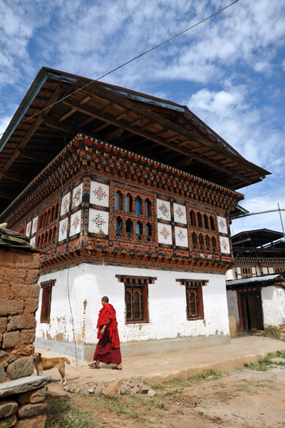 Monk and traditional house, Lobesa