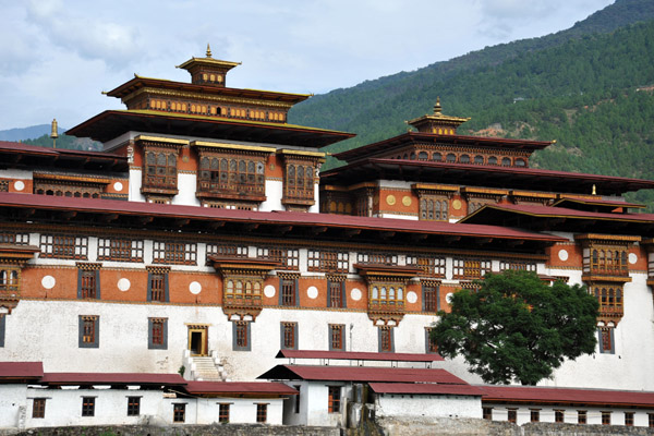 Temple and Assembly Hall of Punakha Dzong rising above the outer walls