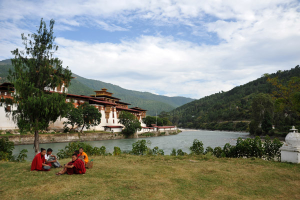 Monks relaxing on the banks of the Mo Chu across from Punakha Dzong