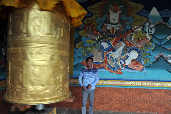 Prayer wheel watched over by Yulkhorsung, the guardian king of the east, lord of celestial musicians