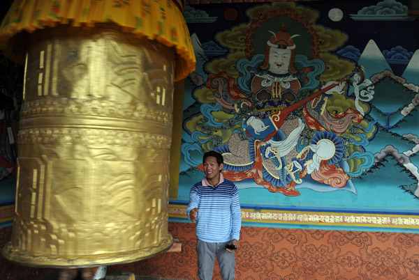 Prayer wheel watched over by Yulkhorsung, the guardian king of the east, lord of celestial musicians