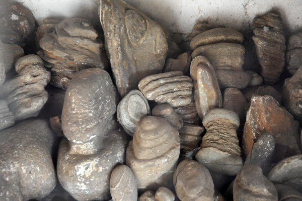 What looks like weather-worn stones - Shrine to the Queen of the Naga Spirits