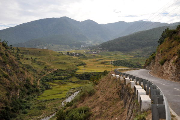 Leaving the rice fields of Lobesa behind driving on the road north to Punakha