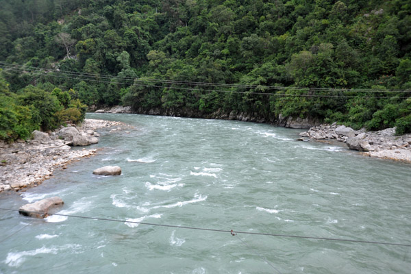 Crossing the river to reach Khamsum Yuelley Namgyal Chorten 