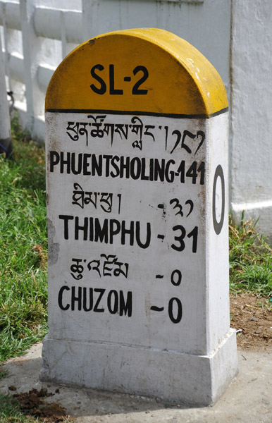 Road marker at Chuzom, 31km to Thimphu and 141 to the Indian border
