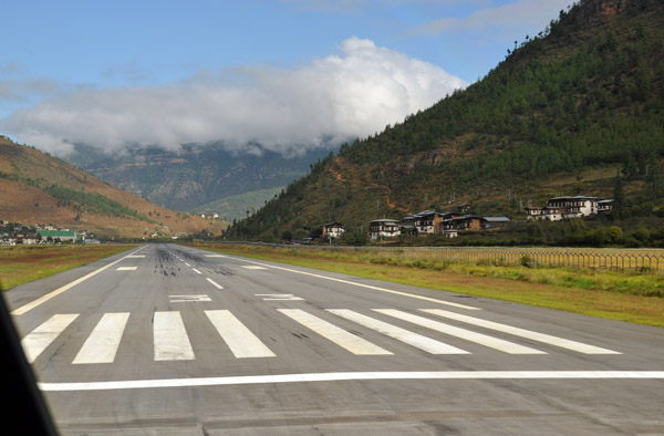 Lining up on Runway 33 at Paro Airport. It will be a visual departure, firs to the right, then down the valley to the left
