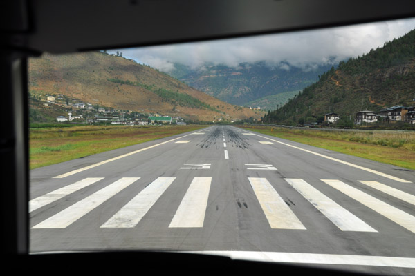 There is so much terrain around, Drukair's SOP is to turn off the terrain warning system for the initial visual climb