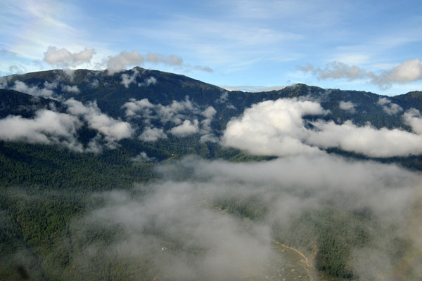 Clouds obscuring the mountains are a hazard flying in and out of Paro