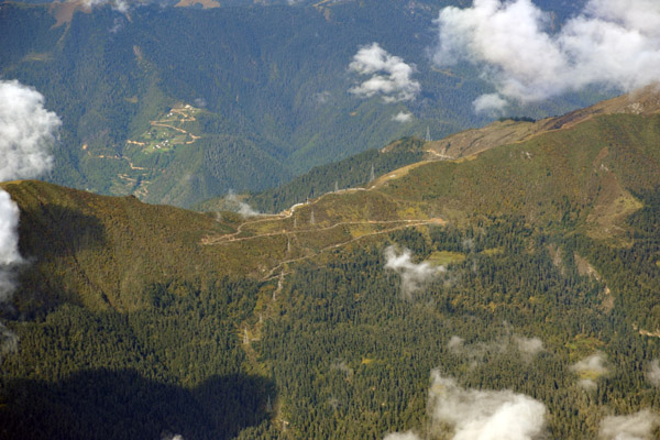 The serpentine dirt road over the pass leading from Paro Valley to neighboring Haa
