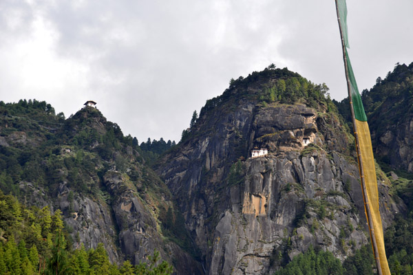 Looking up inspiring location of Taktshang Goemba, the famous Tiger's Nest Monastery 900m up the mountain on a cliff