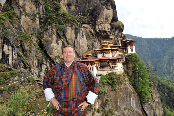 Me wearing a Bhutanese gho at the Tiger's Nest
