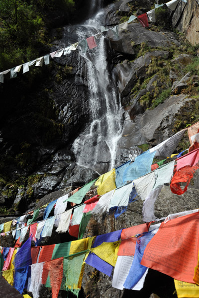 Prayer flags and waterfall