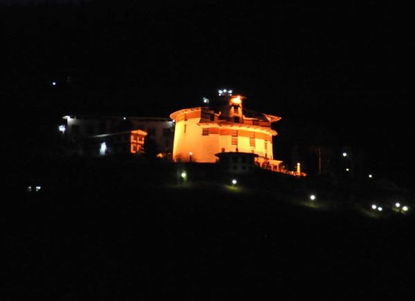 Bhutan National Museum on the hillside overlooking Paro, illuminated at night