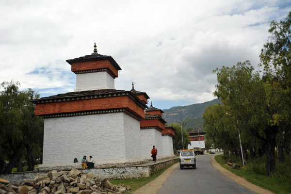 Three stupas (chortens) along the road in Paro