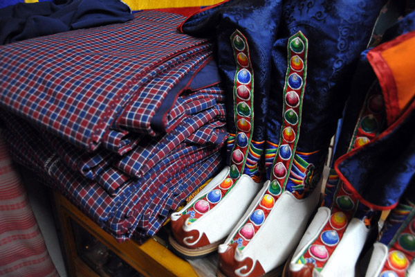 Gho robes and the traditional boots of Bhutan, Paro