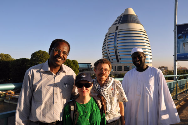 Karen and Trygve with Sudanese men in front of Burj Al-Fateh