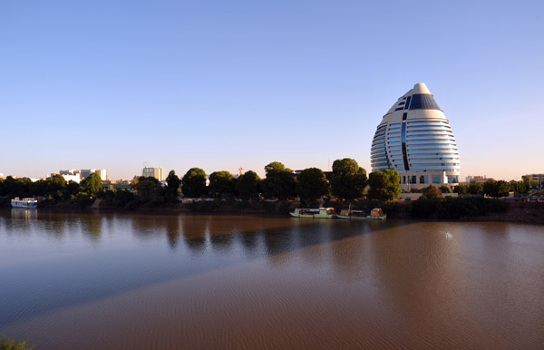 Burj Al-Fateh Hotel from Tuti Island with the rather brown Blue Nile