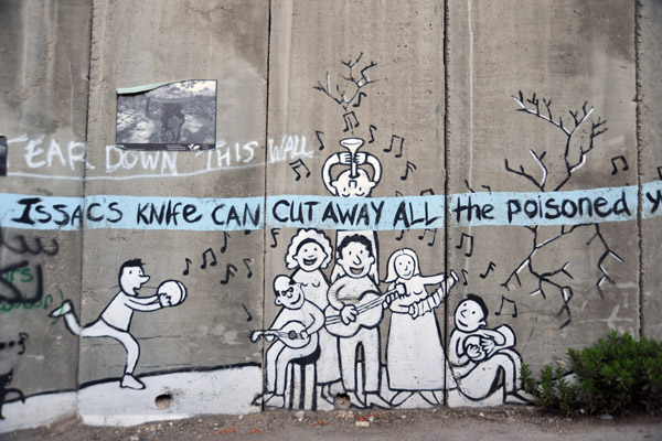 West Bank Separation Wall graffiti - Issacs knife can cut away all the poisoned yesterdays