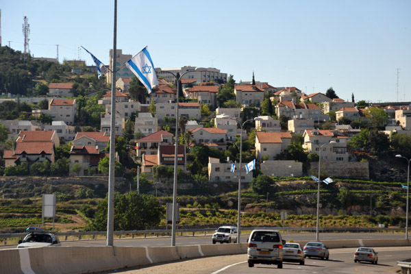 Highway 60 lined with Israeli flags as it passes the Israeli settlement of Efrata (Gefen)